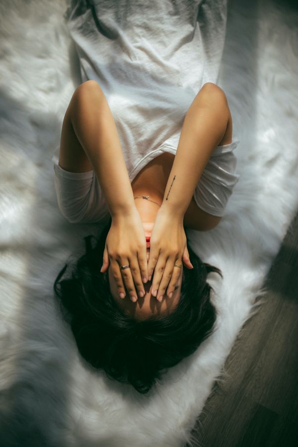 What's the purpose and benefit of negative experiences in terms of energy and vibration?